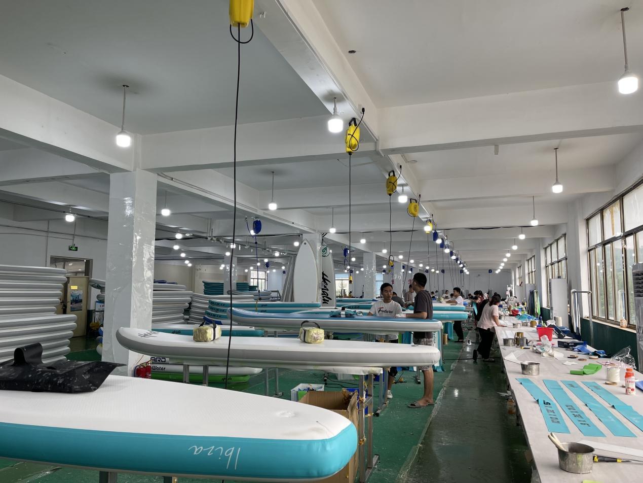 Marcello production team assembling inflatable boards